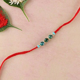 Green agate and stab turquoise beads rakhi in flat woven red thread