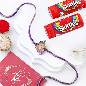 Bal Ganesha Cheerful Charm Rakhi N Skittles Combo