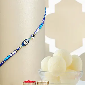 Galactic Blue Protector Evil Eye Rakhi with Rasgulla Tin