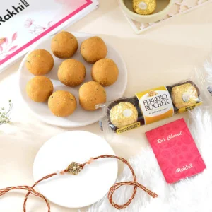 Floral Shaped Rakhi Gift Combo with Besan Laddoo & Ferrero