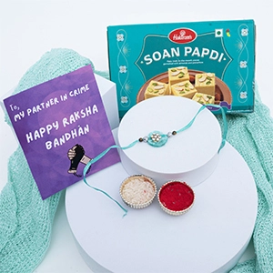 Alluring Blue Rakhi with Soan Papdi