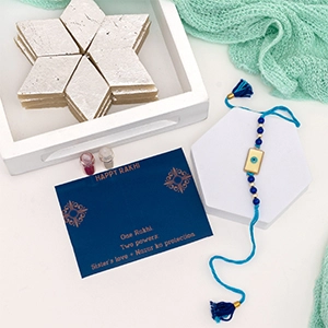 Stunning Evil Eye Rakhi with Kaju Katli