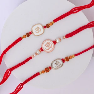 Handcrafted Om Rakhi Pair-Set of 3 Rakhi to Canada