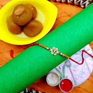 Opulent Om Rakhi With Gulab Jamun