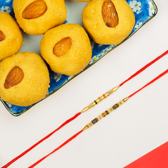 Collection Of 2 Pearl Rakhis With Besan Laddoo