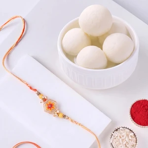 FNP Orange Designer Rakhi With Rasgulla 1 Kg
