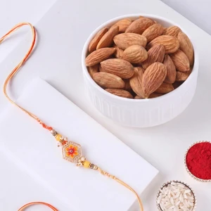 FNP Orange Designer Rakhi With Almonds 200g