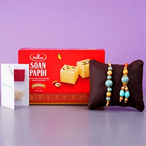 Blue Stone Rakhi Set And Soan Papdi Combo