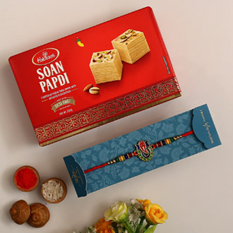 Multicoloured Lord Ganesha Rakhi And Soan Papdi