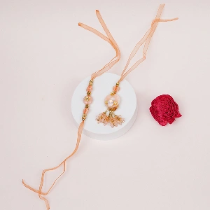 Elegant Peach Thread Bhaiya Bhabhi Lumba Rakhi Set