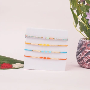 Set of 4 Designer Rakhi Combo for Brother with Roli and Chawal