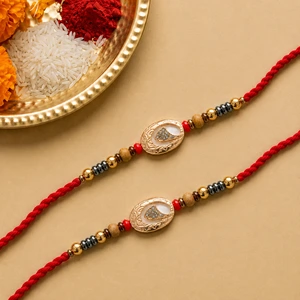 Antique Gold Oval Rakhi Set of 2 with Free Roli Chawal