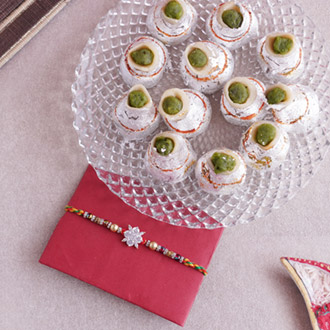 Scintillating Pearl Rakhi with Kaju Kalash Sweets