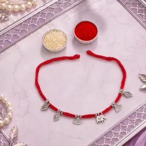 Elegant Red Cotton Rakhi with Dangling Silver Charms