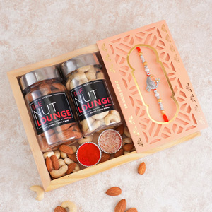 Alluring AD Peacock Rakhi with The Nut Lounge Dry Fruits