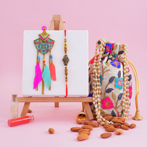 Designer Bhaiya Bhabhi Rakhi with Almonds in Potli