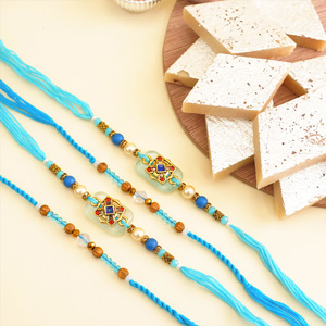 Four Designer Rakhis with Kaju Katli Sweets
