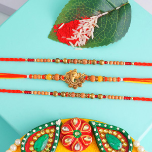 Two Beaded Rakhi N One Golden Ganesha Rakhi
