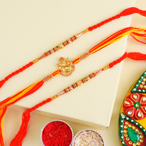 1 Golden Ganesha Rakhi N 2 Beaded Rakhi