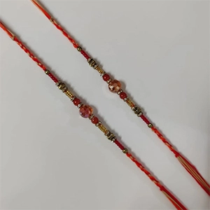 Mauli Thread Paired With Beautiful Pearls Rakhi (Pack of 2)