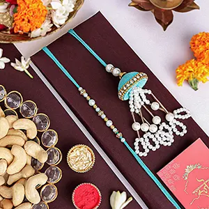 Tranquil Teal Jhumar Bhaiya Bhabhi Pearl Rakhi Set N Cashew Combo-Rakhi Gift Hampers to Singapore