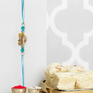 Divine Krishna Flute Rakhi with Soan Papdi