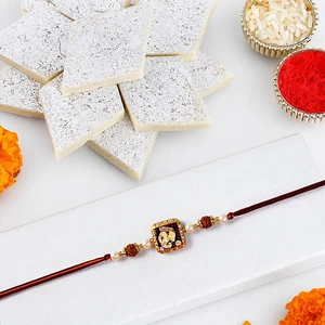 Divine Ganesha Rudraksha Pearl Rakhi with Kaju Katli