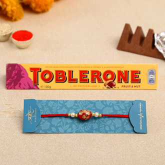 Japanese Red Stone Rakhi And Toblerone Chocolate