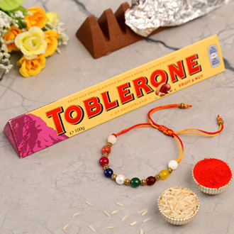 Navrattan Bracelet Pearl Rakhi And Toblerone Chocolate