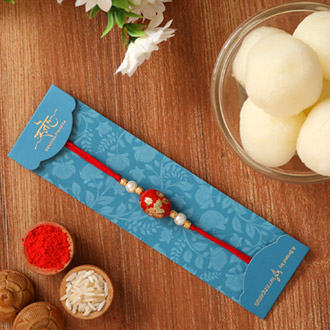 Japanese Red Stone Rakhi And Rasgulla