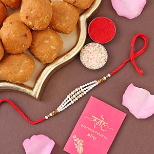 Pearl Bead Rakhi and Besan Ladoo Combo Singapore - Rakhi with Pooja Thali to Singapore