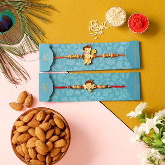 2 Devotional Kids Rakhis & Almonds Combo