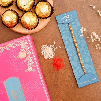Traditional Pearl Mauli Rakhi And 3 Pcs Ferrero Rocher