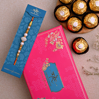 Elegant Pearl Mauli Rakhi And 3 Pcs Ferrero Rocher