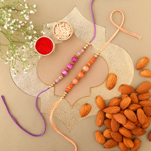 Sneh Peachy Rakhi Set with 250 Grams Almonds