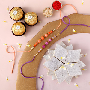 Sneh Peachy Rakhi Set with 250 Grams Kaju Katli and 3 Ferrero Rocher