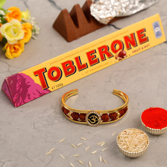 Om And Rudraksha Bracelet Rakhi With Toblerone Chocolate