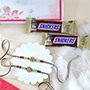 Floral Shape Rakhi Set with Snickers