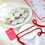Set of 2 Red Beaded Rakhi with Kaju katli.