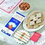 Set of Four Alluring Rakhi with Gourmet Hamper