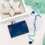 Stunning Evil Eye Rakhi with Kaju Katli