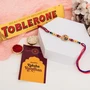 Shrinathji Designer Rakhi with Toblerone Chocolate Gift