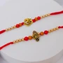 Sacred Om and Ganesha Rakhi Pair