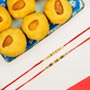 Collection Of 2 Pearl Rakhis With Besan Laddoo