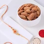 FNP Orange Designer Rakhi With Almonds 200g