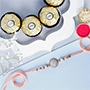 Rosy American Diamond Rakhi N Ferrero Delight