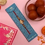 Ganesha Face Kids Rakhi And Gulab Jamun Exp