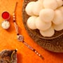 Sneh Holy Om Rakhi & Rasgullas