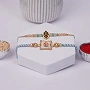 Divine Ganesha Rakhi Set of 2 with Roli Chawal