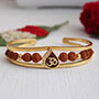 Golden Om & Rudraksha Bracelet Rakhi